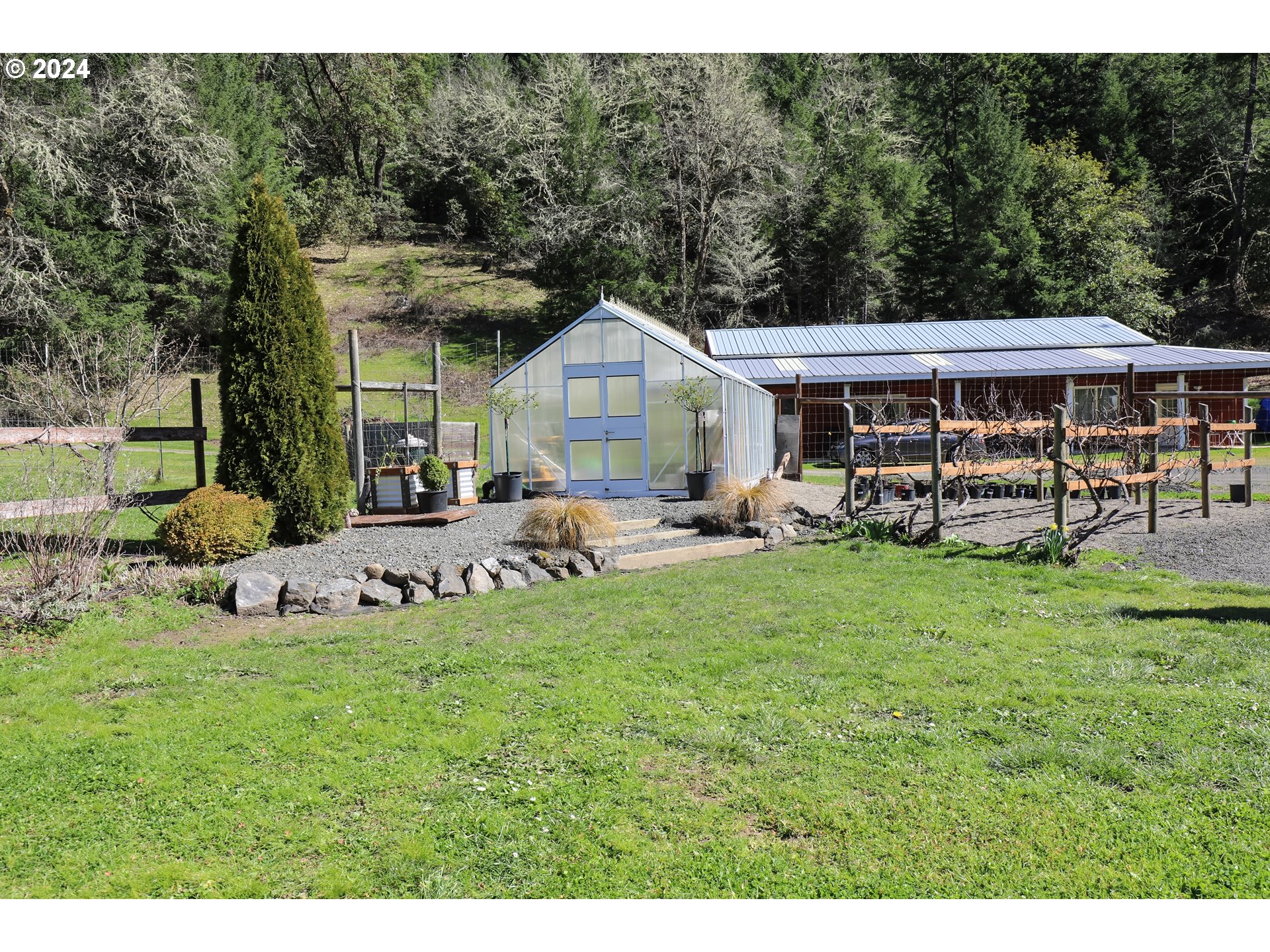 6910 Upper Olalla Road Winston, OR 97496 - Photo 38 of 48 a front view of a house with garden