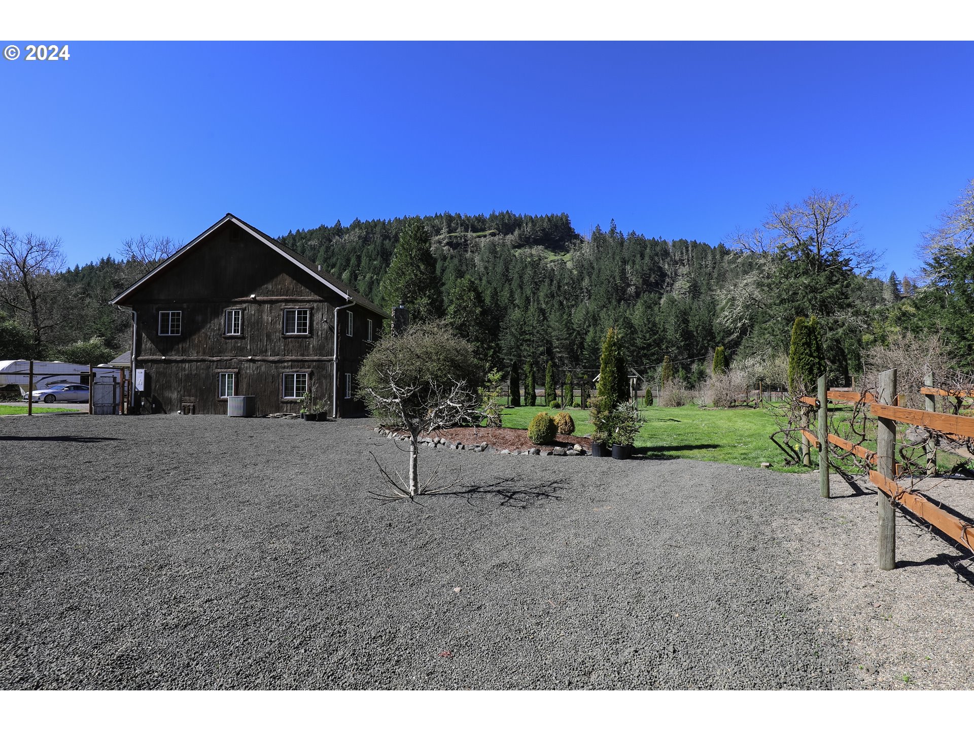 6910 Upper Olalla Road Winston, OR 97496 - Photo 40 of 48 a front view of a house with a yard