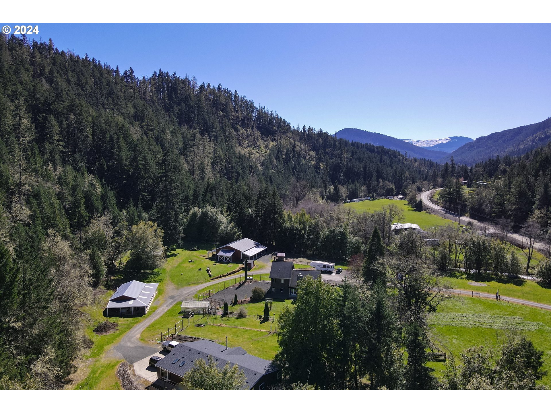 6910 Upper Olalla Road Winston, OR 97496 - Photo 42 of 48 a view of a house with a garden