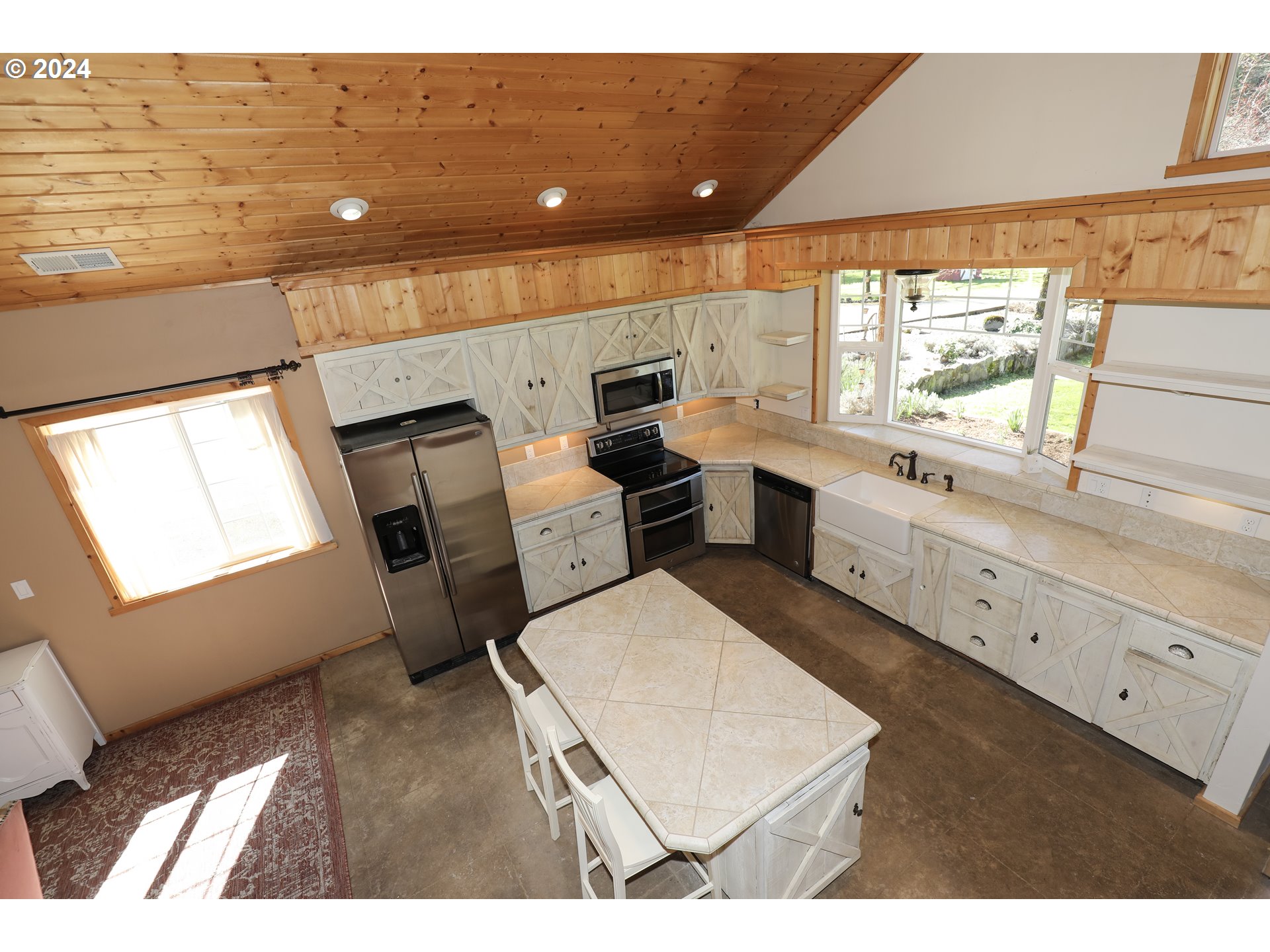 6910 Upper Olalla Road Winston, OR 97496 - Photo 9 of 48 a upper view of living room with a sink hardwood floor and staircase