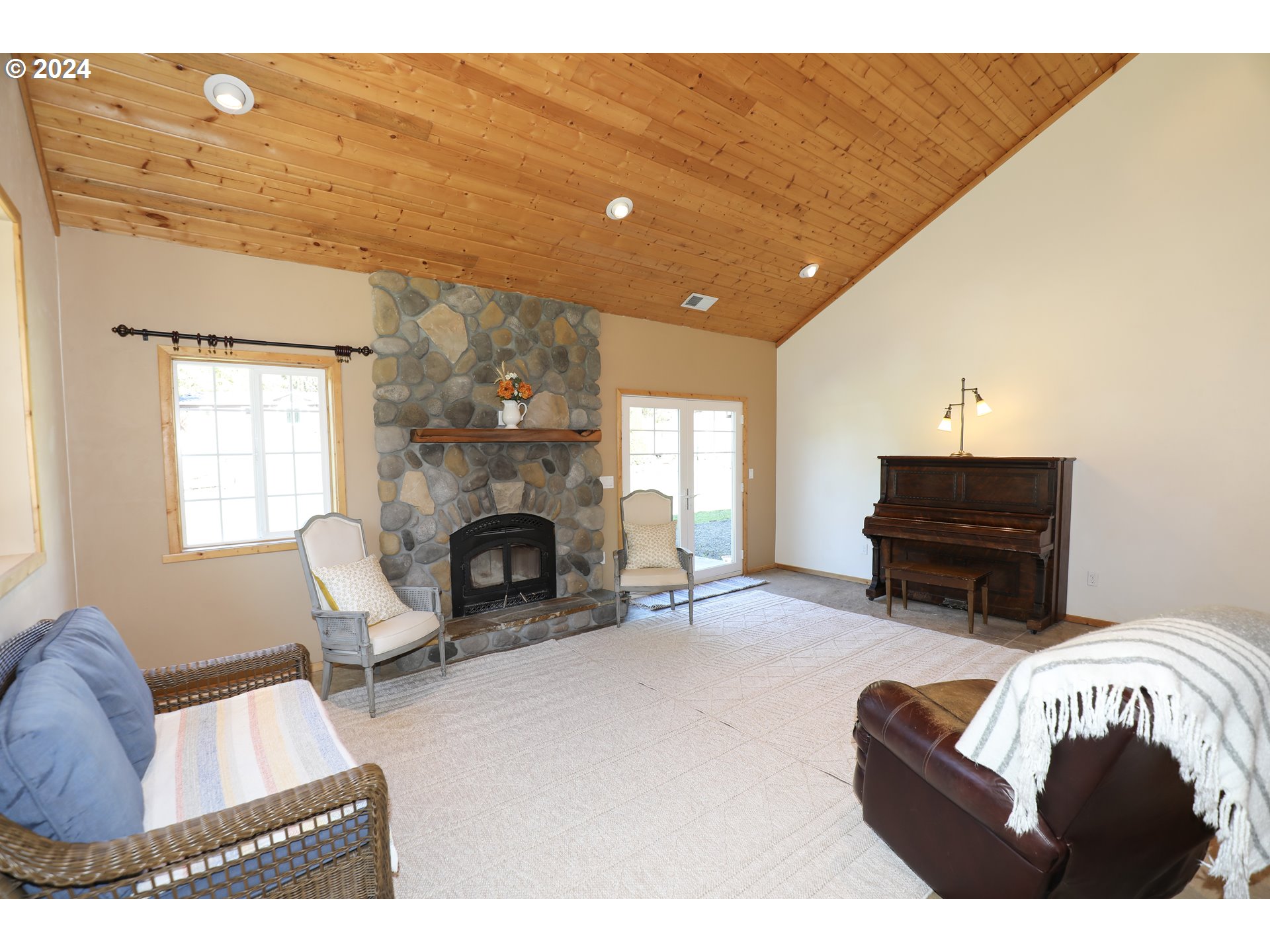 6910 Upper Olalla Road Winston, OR 97496 - Photo 10 of 48 a living room with furniture and a fireplace