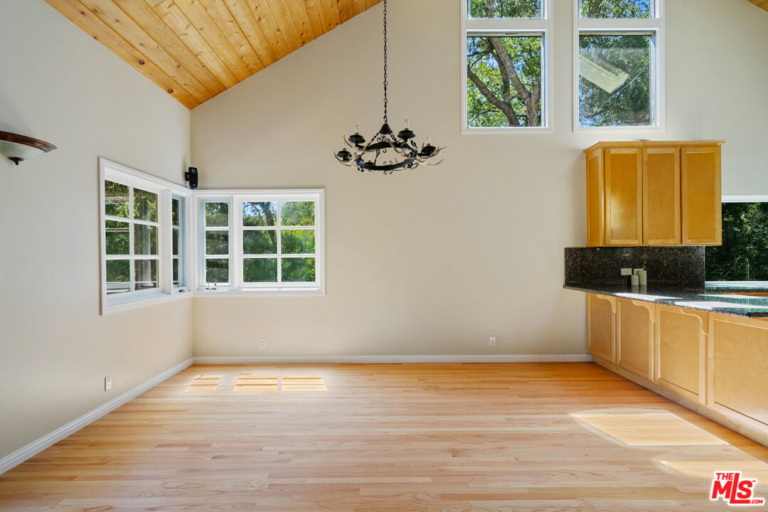 20912 Fontaine Road Topanga, CA 90290 - Photo 7 of 52 a view of a room with wooden floor and a window