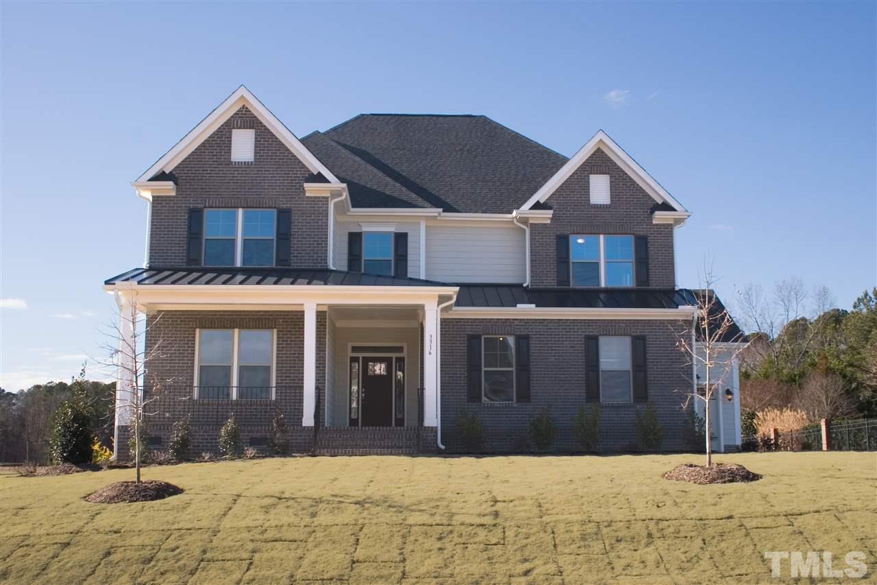 3316 Cotten Road, Unit 83 Raleigh, NC 27603 - Photo 1 of 21 a front view of a house with a yard