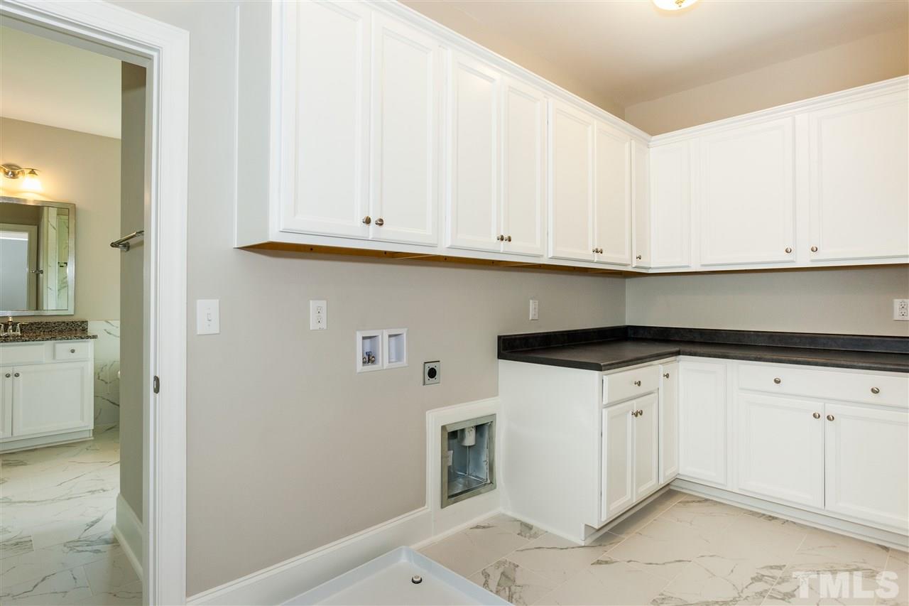 3316 Cotten Road, Unit 83 Raleigh, NC 27603 - Photo 12 of 21 a kitchen with white cabinets and white appliances