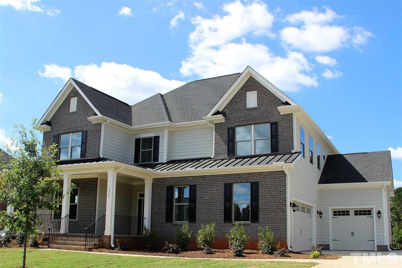 3316 Cotten Road, Unit 83 Raleigh, NC 27603 - Photo 15 of 21 a front view of a house with a garden