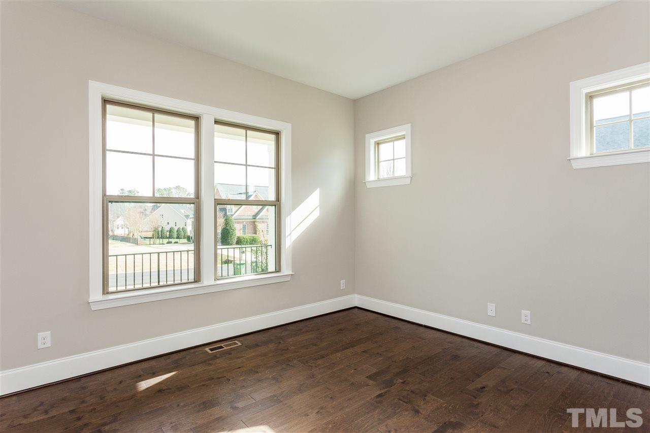 3316 Cotten Road, Unit 83 Raleigh, NC 27603 - Photo 3 of 21 an empty room with wooden floor and windows