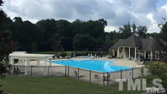 3316 Cotten Road, Unit 83 Raleigh, NC 27603 - Photo 21 of 21 a view of a house with pool and yard