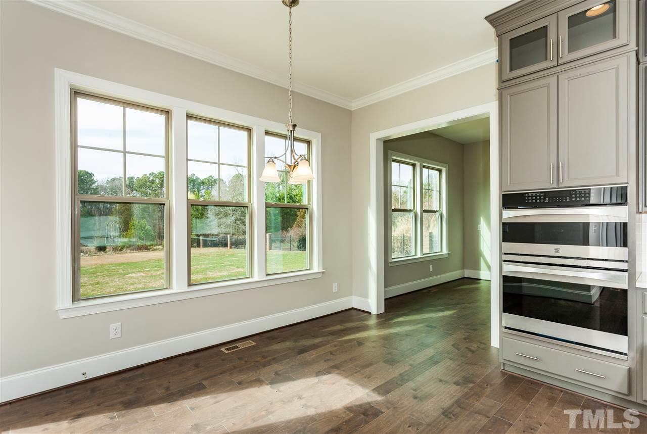 3316 Cotten Road, Unit 83 Raleigh, NC 27603 - Photo 8 of 21 a view of an empty room with a window and kitchen view