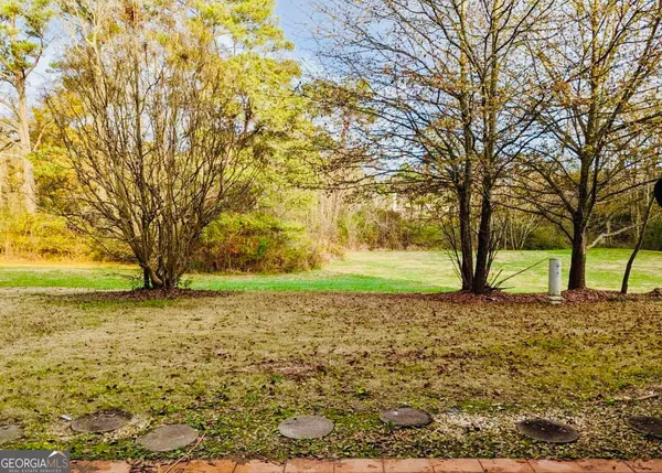 a view of a yard with a trees