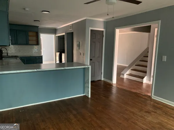 a close up of a utility room with washer and dryer