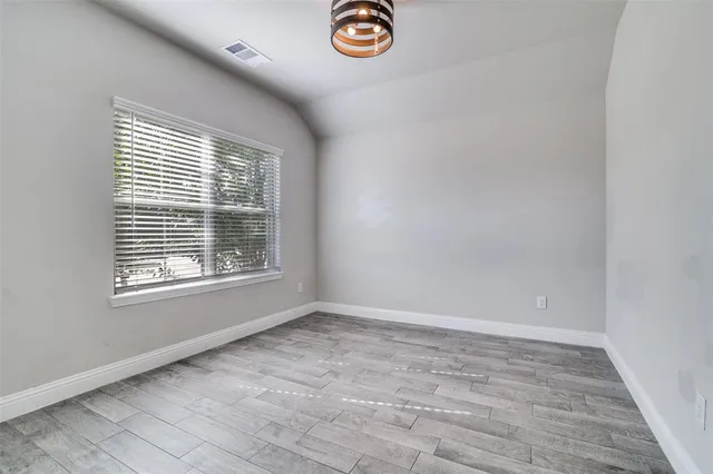 an empty room with windows