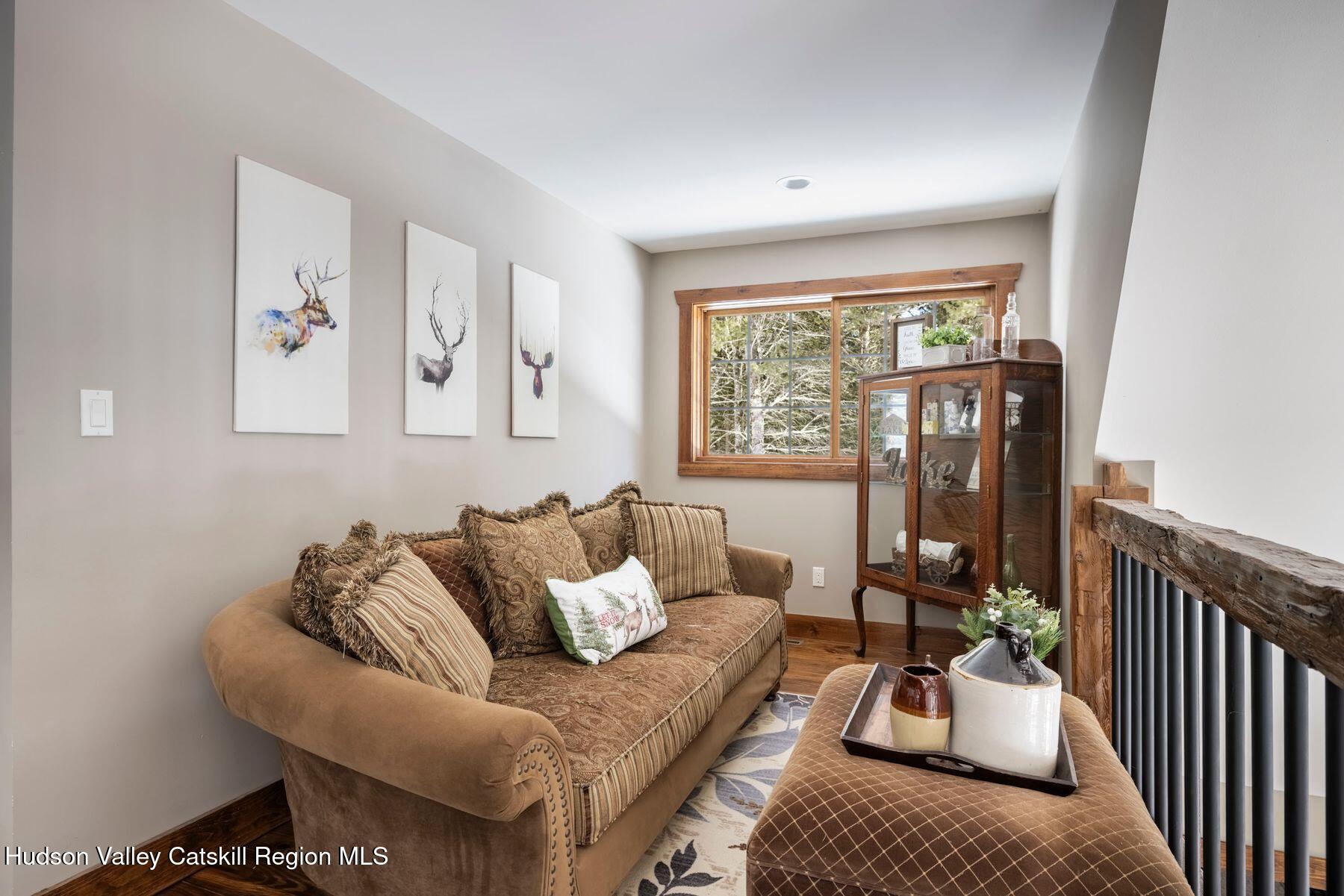 85 Conifer Lake Road West Jewett, NY 12444 - Photo 23 of 50 a living room with furniture and a large window