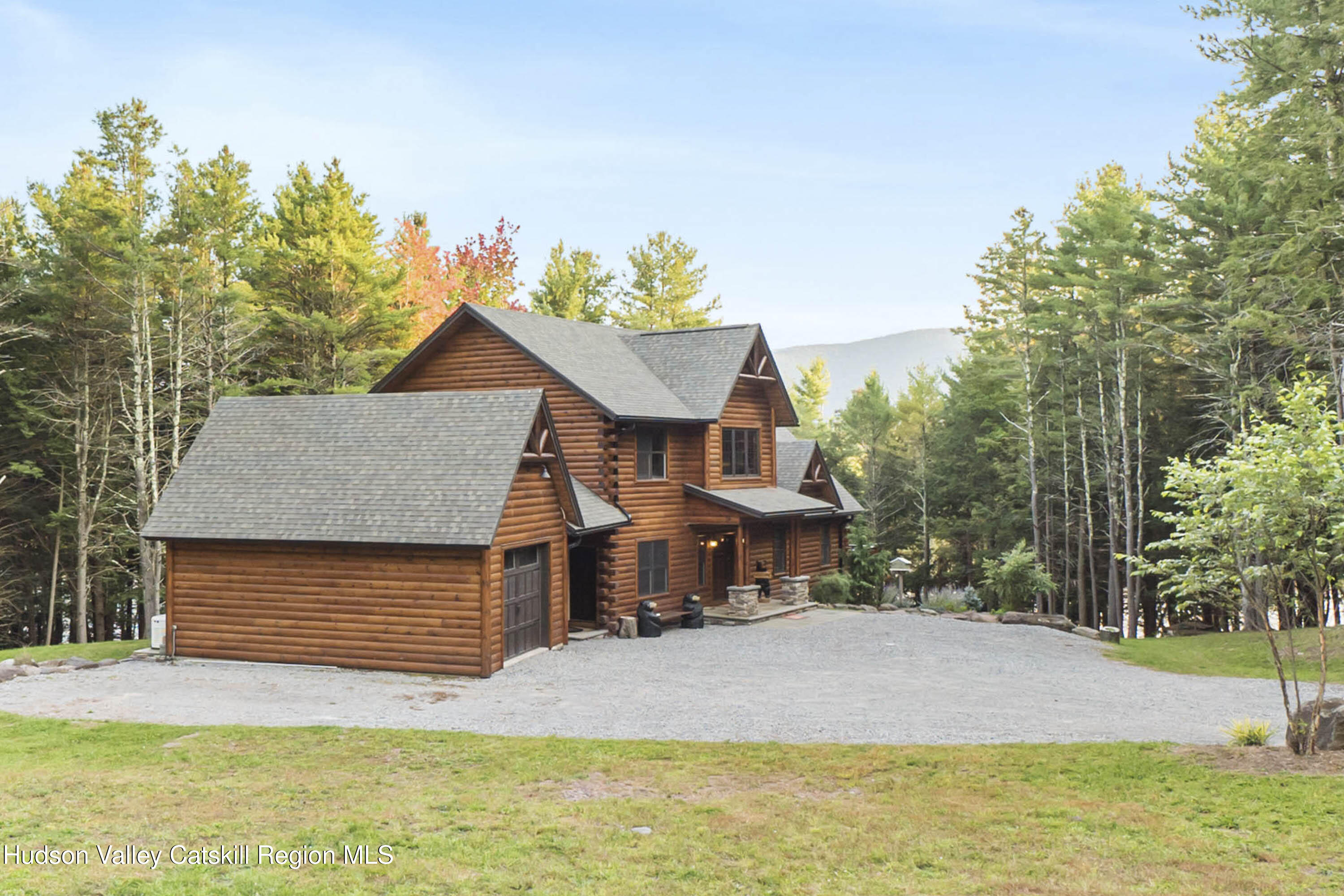 85 Conifer Lake Road West Jewett, NY 12444 - Photo 3 of 50 a front view of a house with a yard and garage