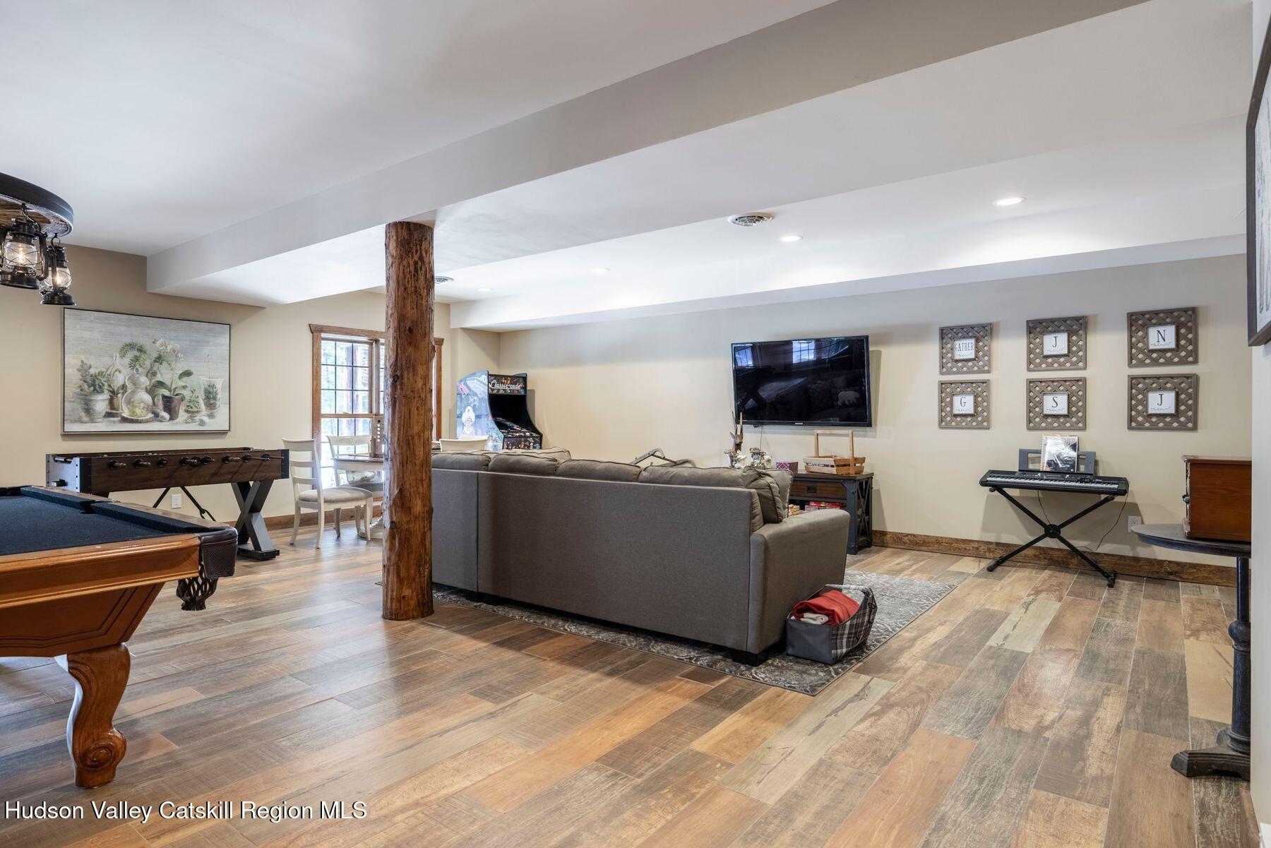85 Conifer Lake Road West Jewett, NY 12444 - Photo 32 of 50 a living room with furniture and a flat screen tv