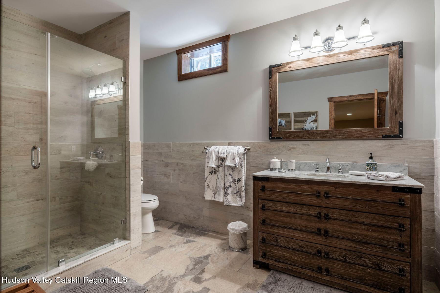 85 Conifer Lake Road West Jewett, NY 12444 - Photo 39 of 50 a bathroom with a sink a toilet and shower