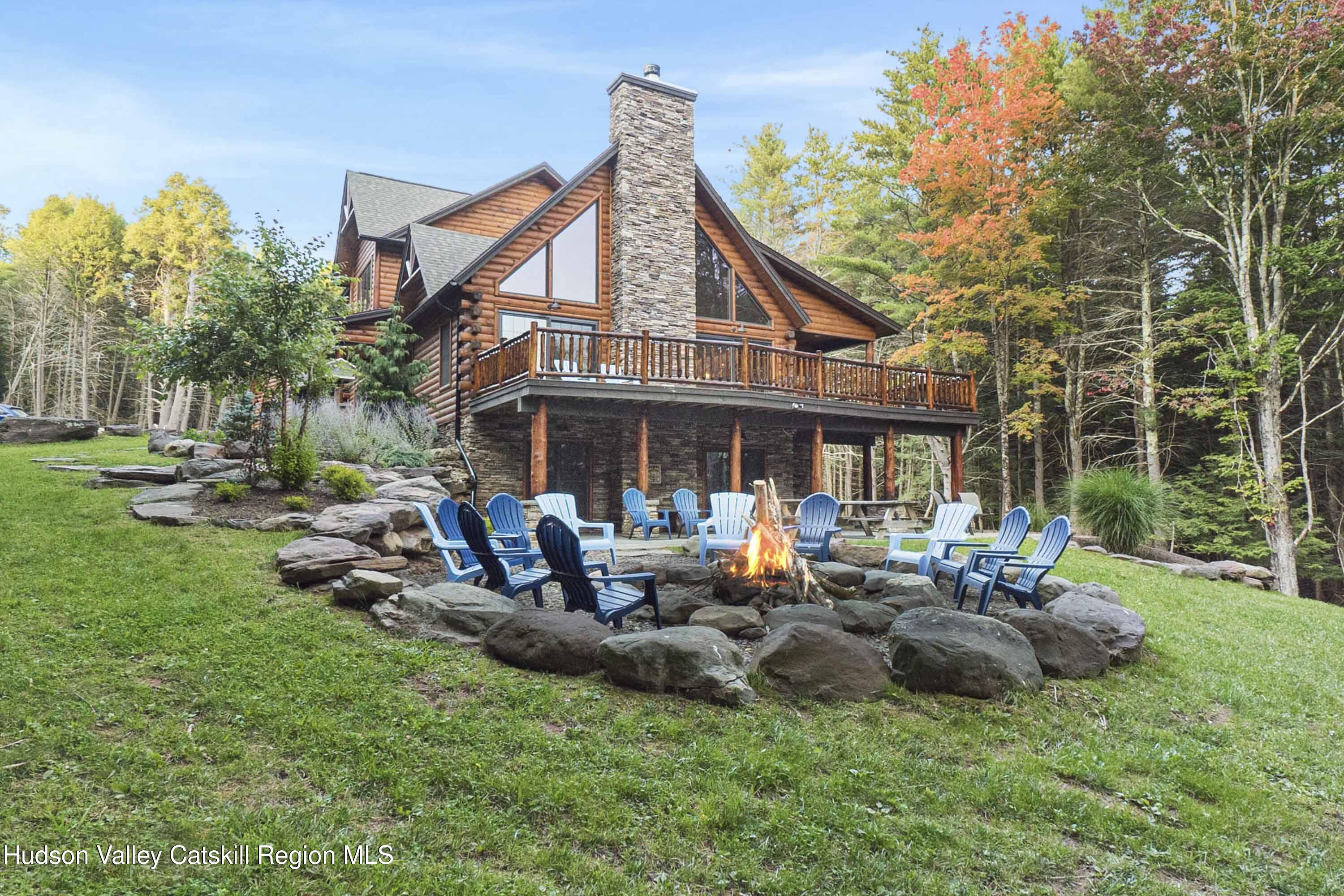 85 Conifer Lake Road West Jewett, NY 12444 - Photo 4 of 50 a view of a house with backyard sitting area and garden