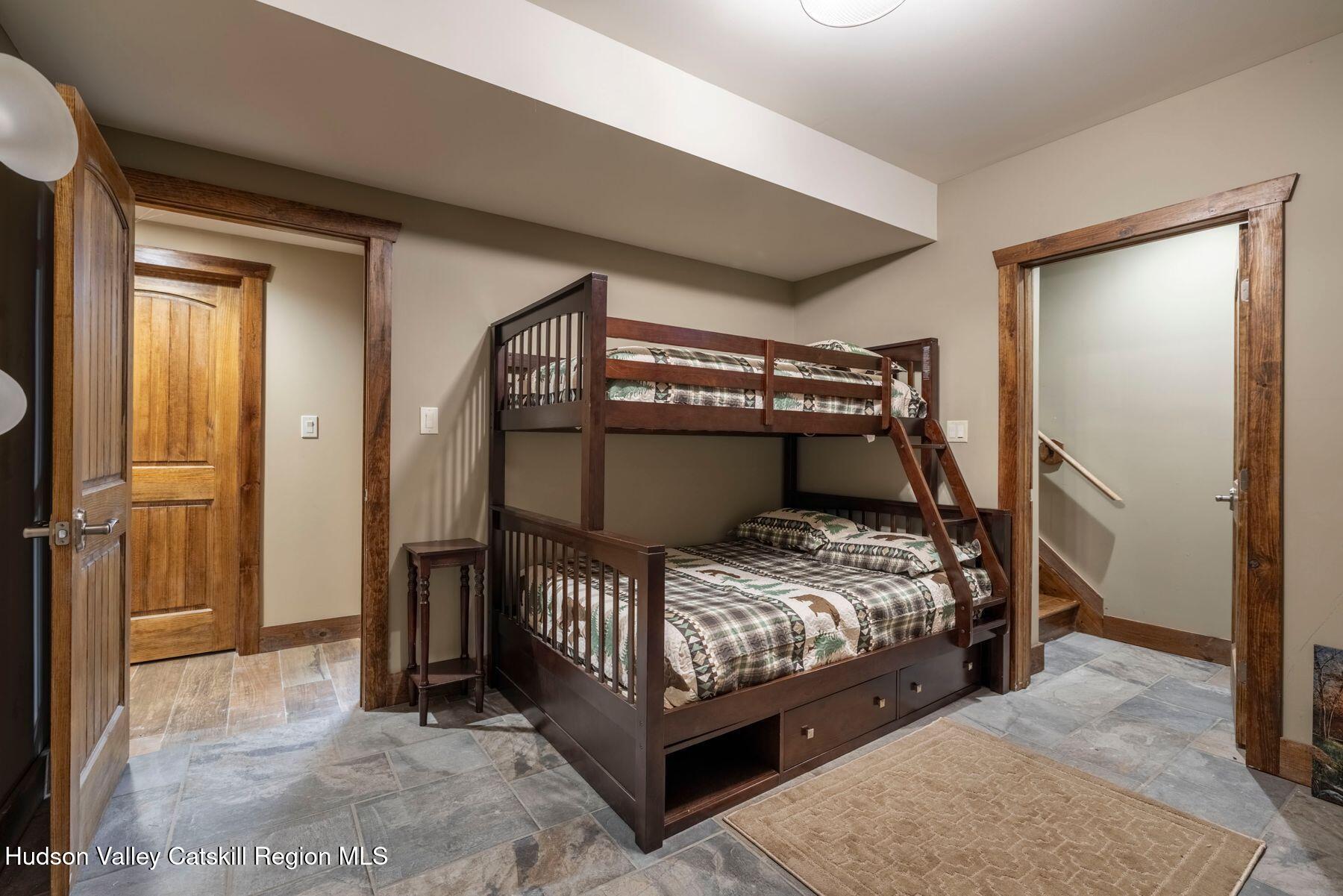 85 Conifer Lake Road West Jewett, NY 12444 - Photo 41 of 50 a bedroom with a bed and a large mirror