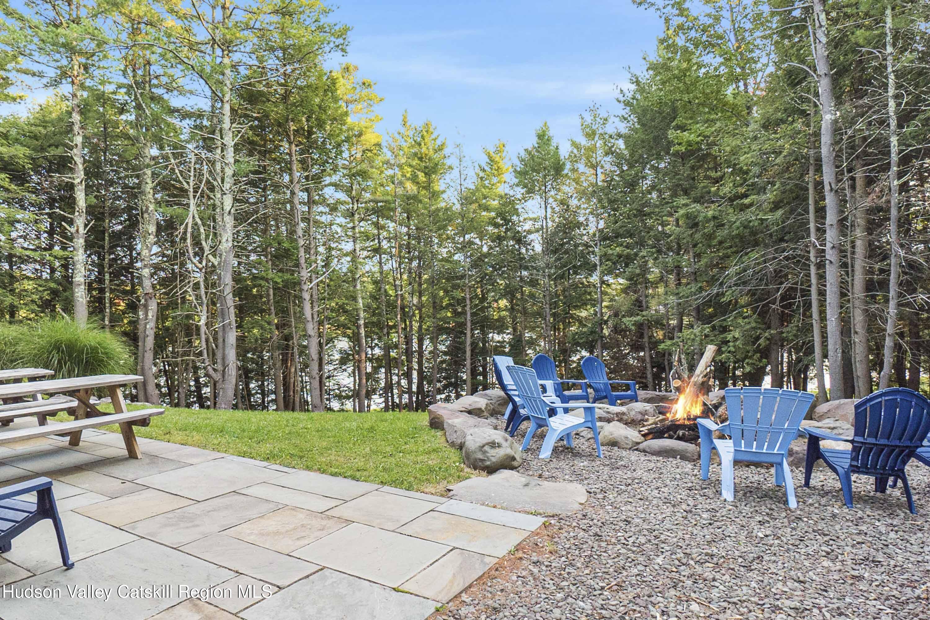 85 Conifer Lake Road West Jewett, NY 12444 - Photo 48 of 50 a view of a tables and chairs in the patio next to a yard