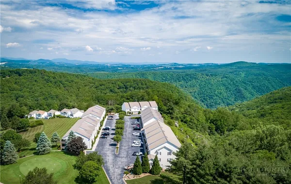 an aerial view of house with yard