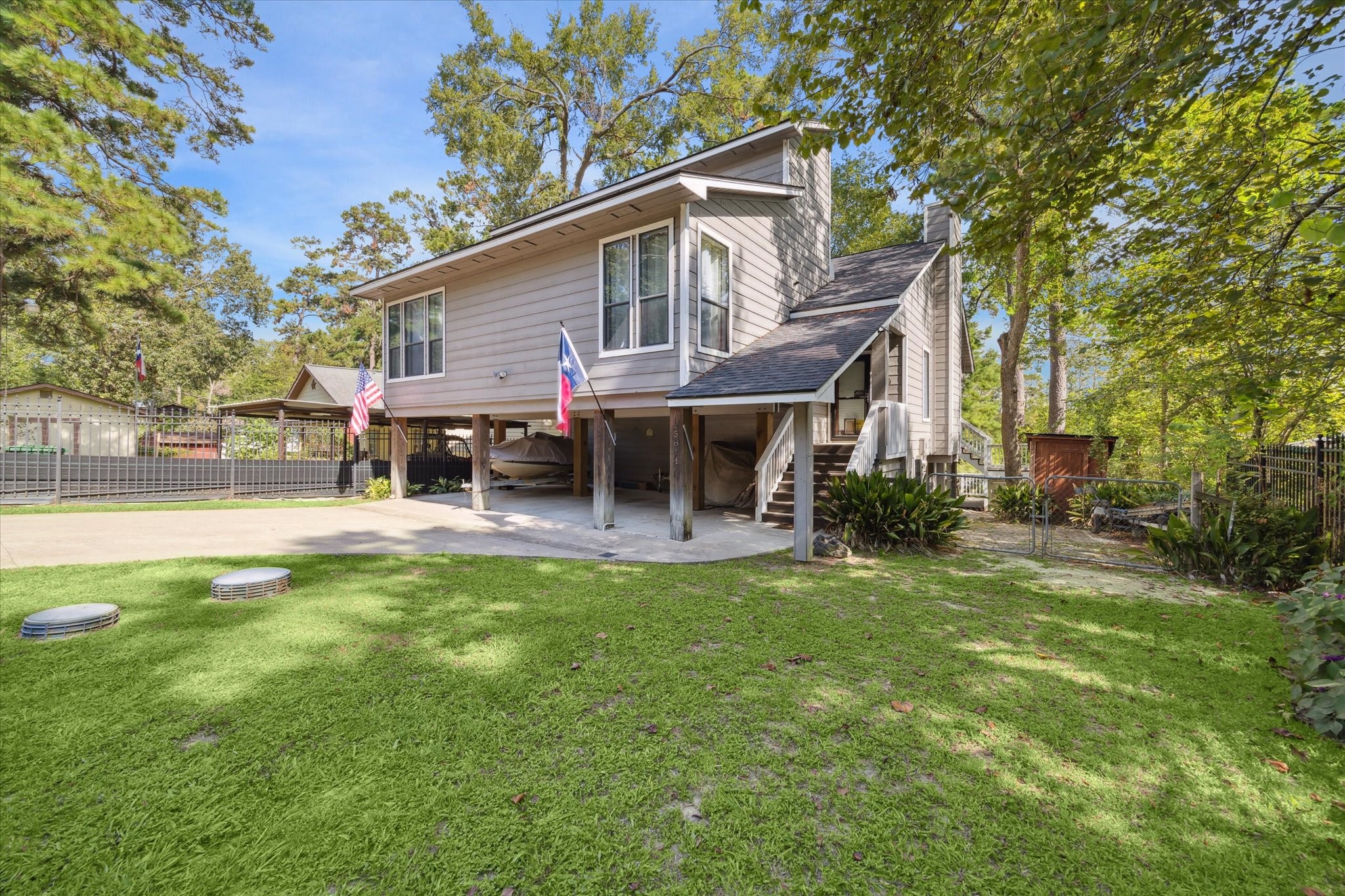 25814 Water Ridge Drive Houston, TX 77336 - Photo 4 of 42 Front yard is fully fenced. Covered parking for watercraft or cars. Yard storage on the side of the main entrance. *Watercraft not included.