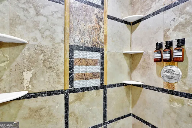 a bathroom with a tub sink and mirror