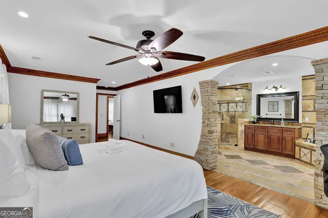 a kitchen with stainless steel appliances kitchen island granite countertop a refrigerator and a stove top oven