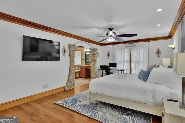 a spacious bathroom with a double vanity sink a mirror and a bathtub