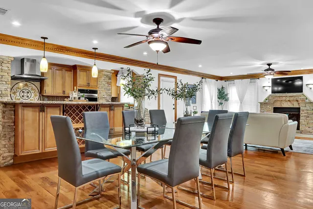 a living room with couches and a flat screen tv