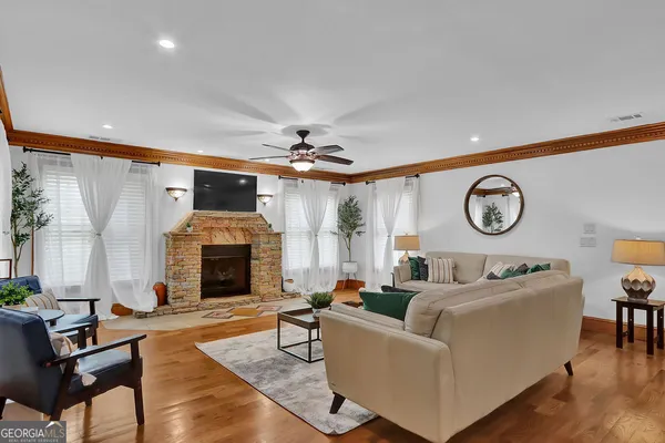 a front view of house with yard and outdoor seating