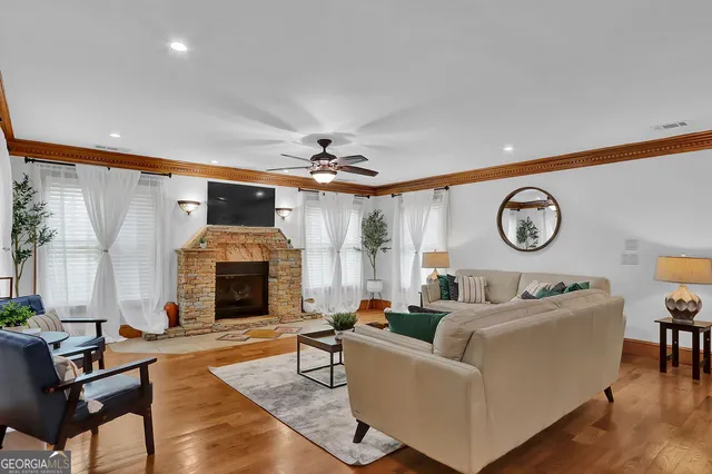 a front view of house with yard and outdoor seating