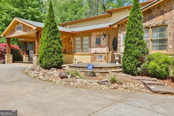 a bedroom with a large bed and a flat screen tv