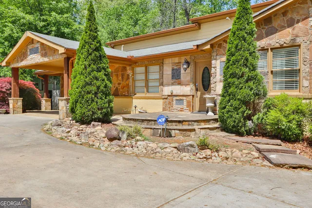 a bedroom with a large bed and a flat screen tv