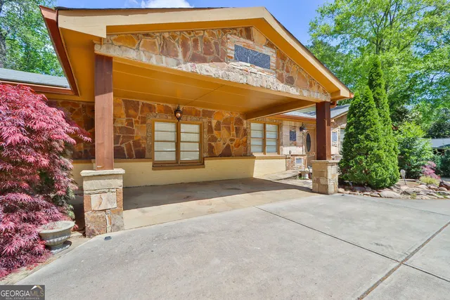 a bedroom with a bed and ceiling fan