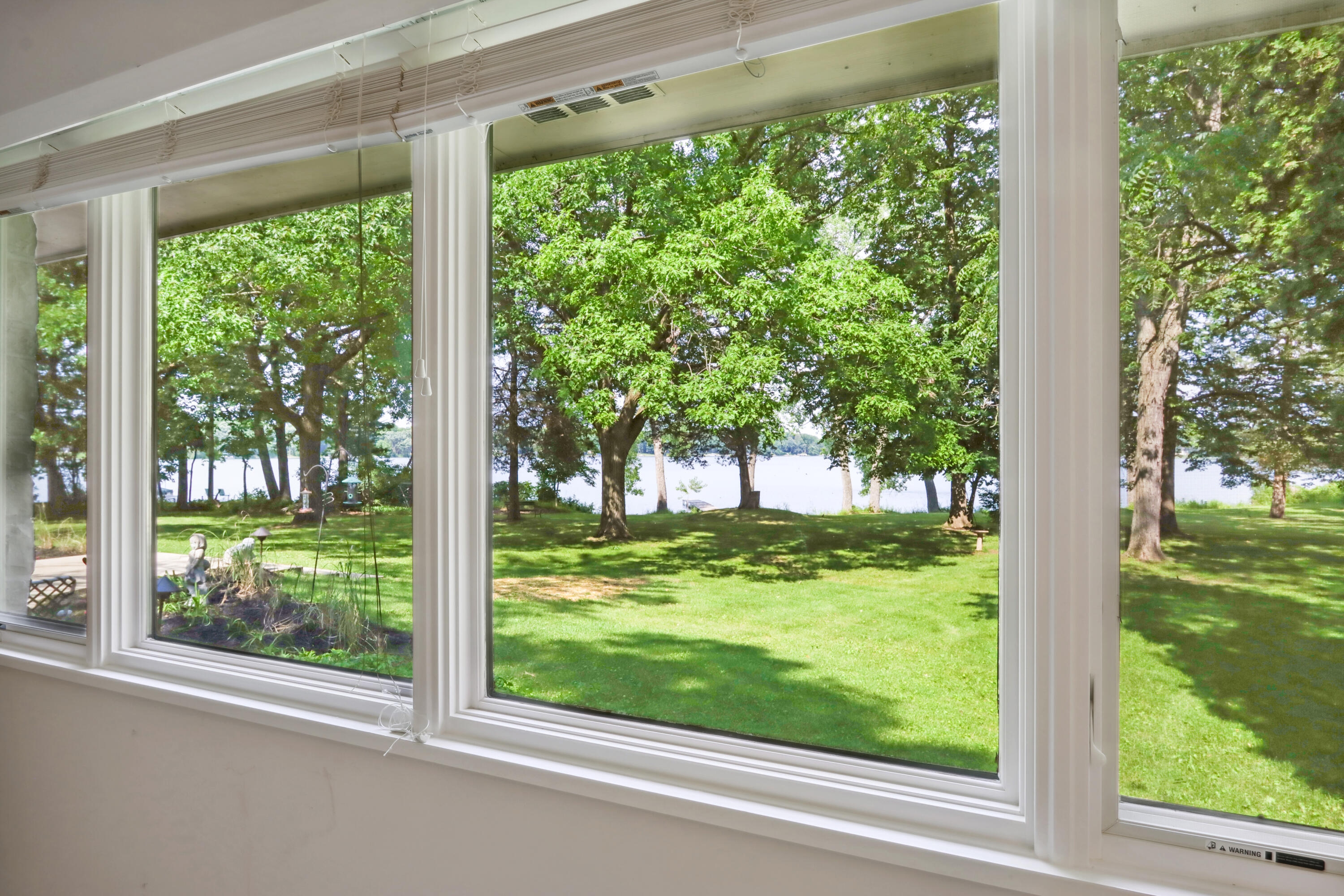 1330 North Dousman Road Summit, WI 53066 - Photo 24 of 34 Enjoy expansive views of the lush yard and serene lake from the Master Suite.