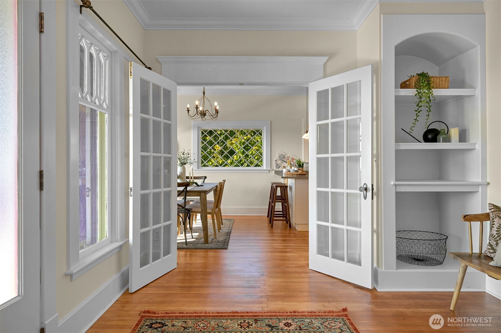 903 13th Street Bellingham, WA 98225 - Photo 15 of 40 a dining room with wooden floor and a floor to ceiling window