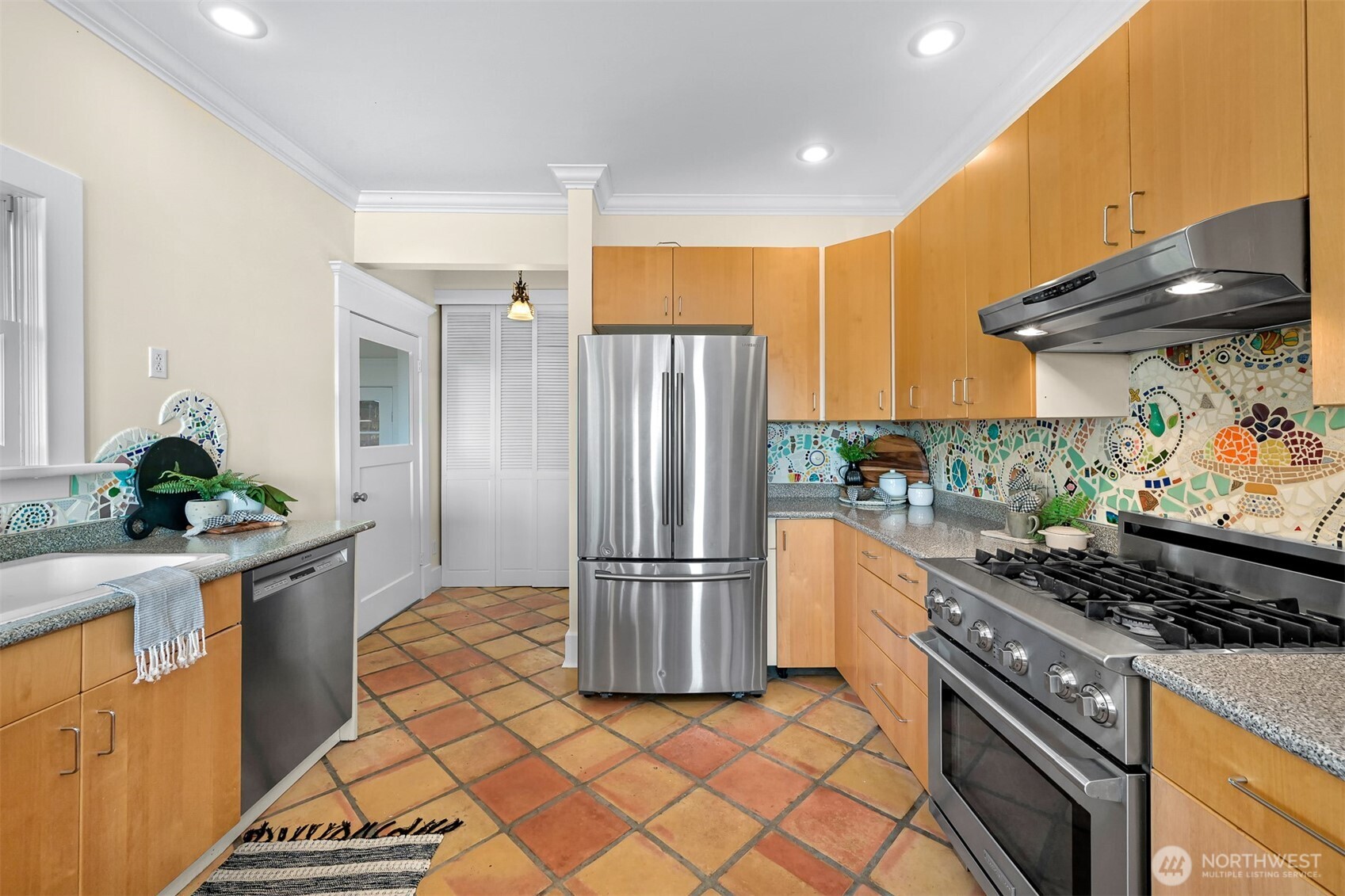 903 13th Street Bellingham, WA 98225 - Photo 22 of 40 a kitchen with stainless steel appliances granite countertop a refrigerator and a stove