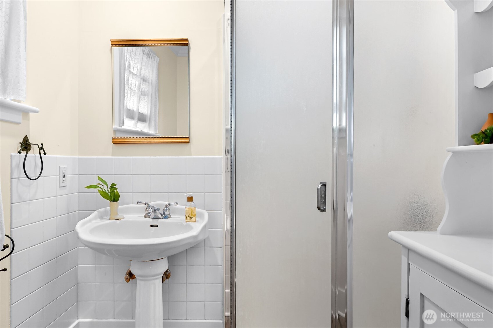903 13th Street Bellingham, WA 98225 - Photo 24 of 40 a bathroom with a sink a toilet and mirror