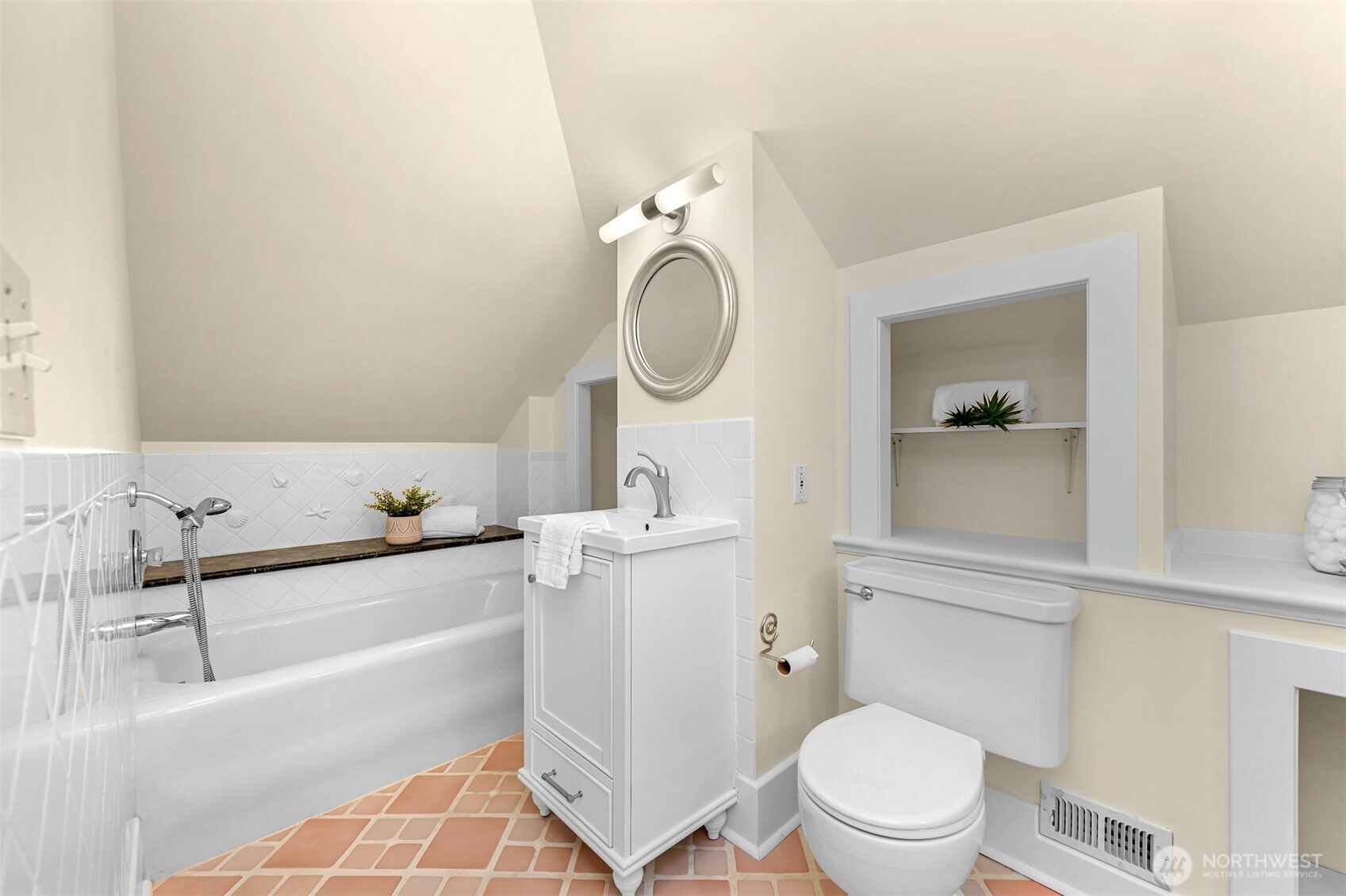 903 13th Street Bellingham, WA 98225 - Photo 30 of 40 a bathroom with a sink a toilet and a mirror