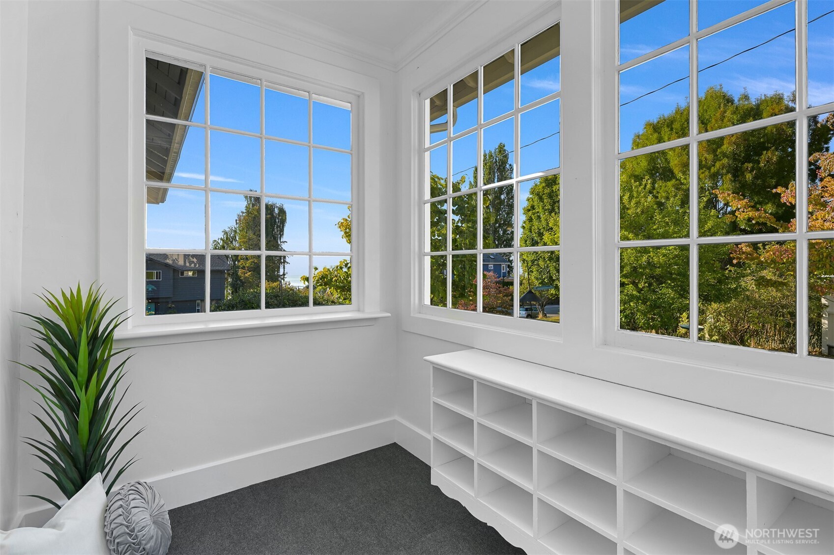 903 13th Street Bellingham, WA 98225 - Photo 34 of 40 a view of a house with a large window and a potted plant on a window