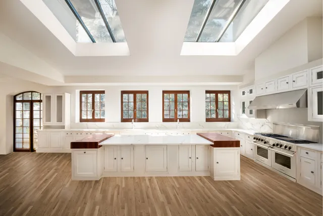 a view of a livingroom with wooden floor and window