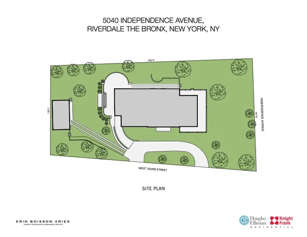 a view of a white building with a big yard