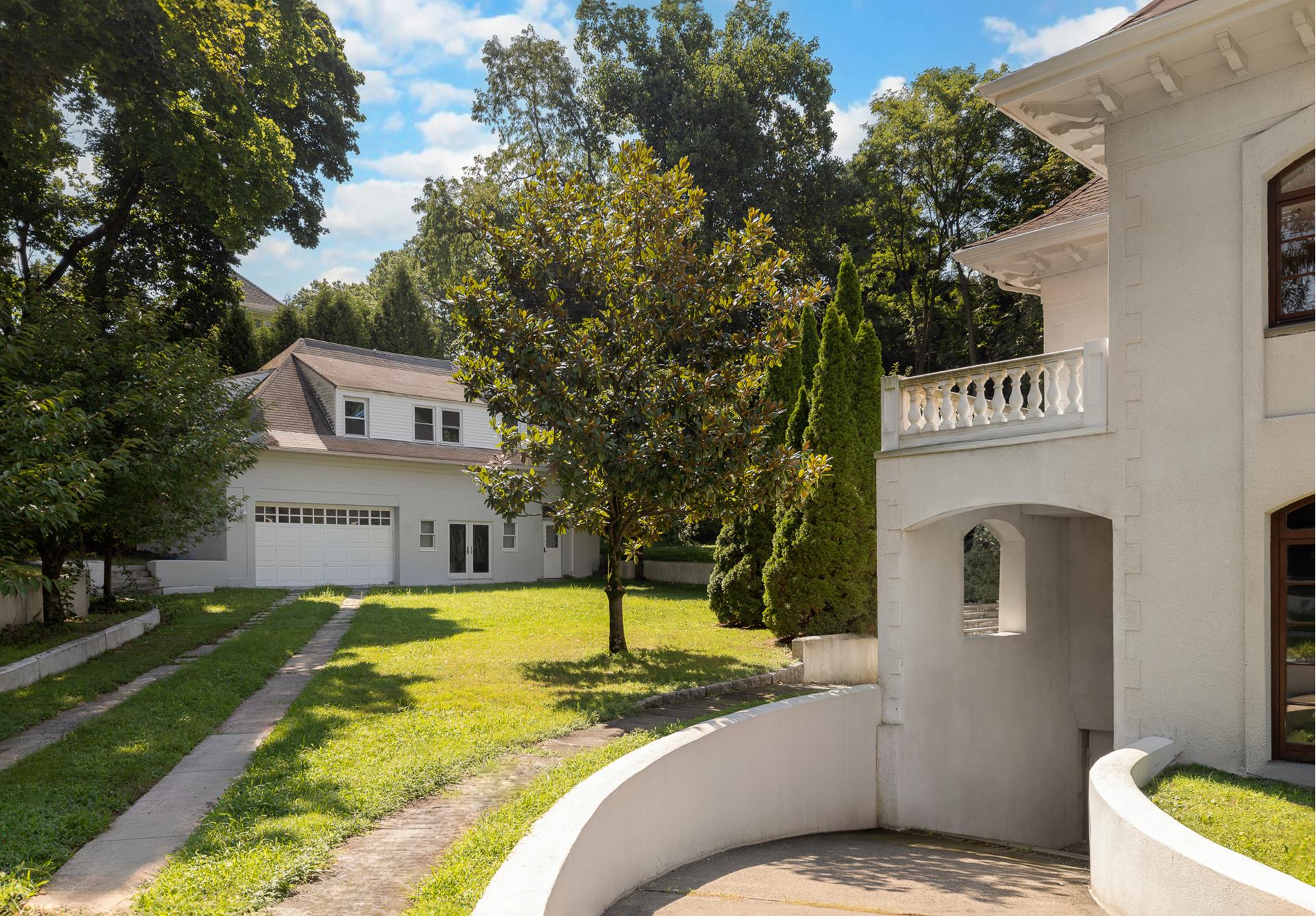 5040 Independence Avenue Bronx, NY 10471 - Photo 20 of 27 a view of house with outdoor space and swimming pool