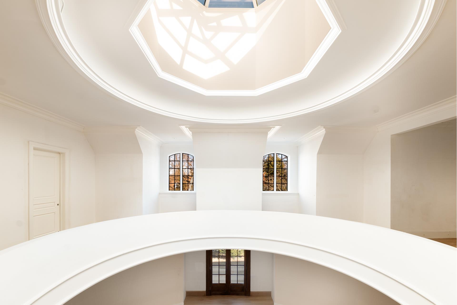 5040 Independence Avenue Bronx, NY 10471 - Photo 3 of 27 a bedroom with a bed and a large mirror