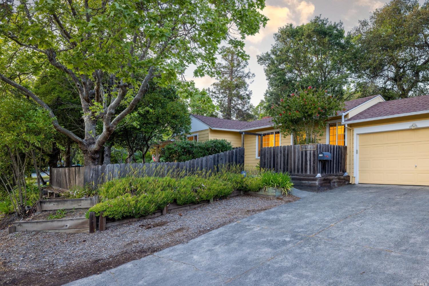 a view of a house with a yard and garage