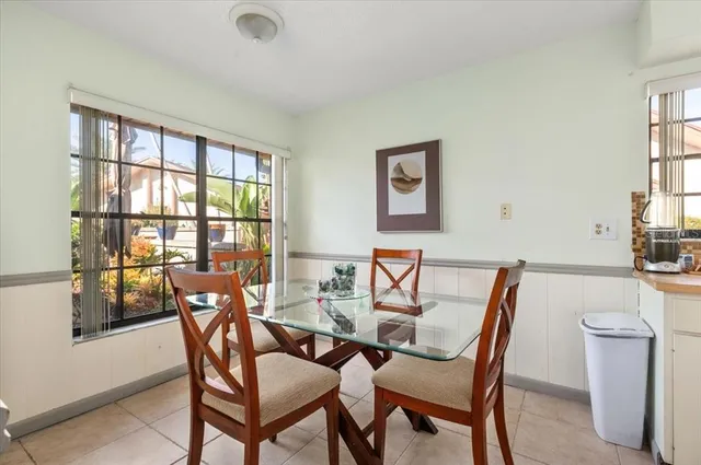 a view of a dining room with furniture and window