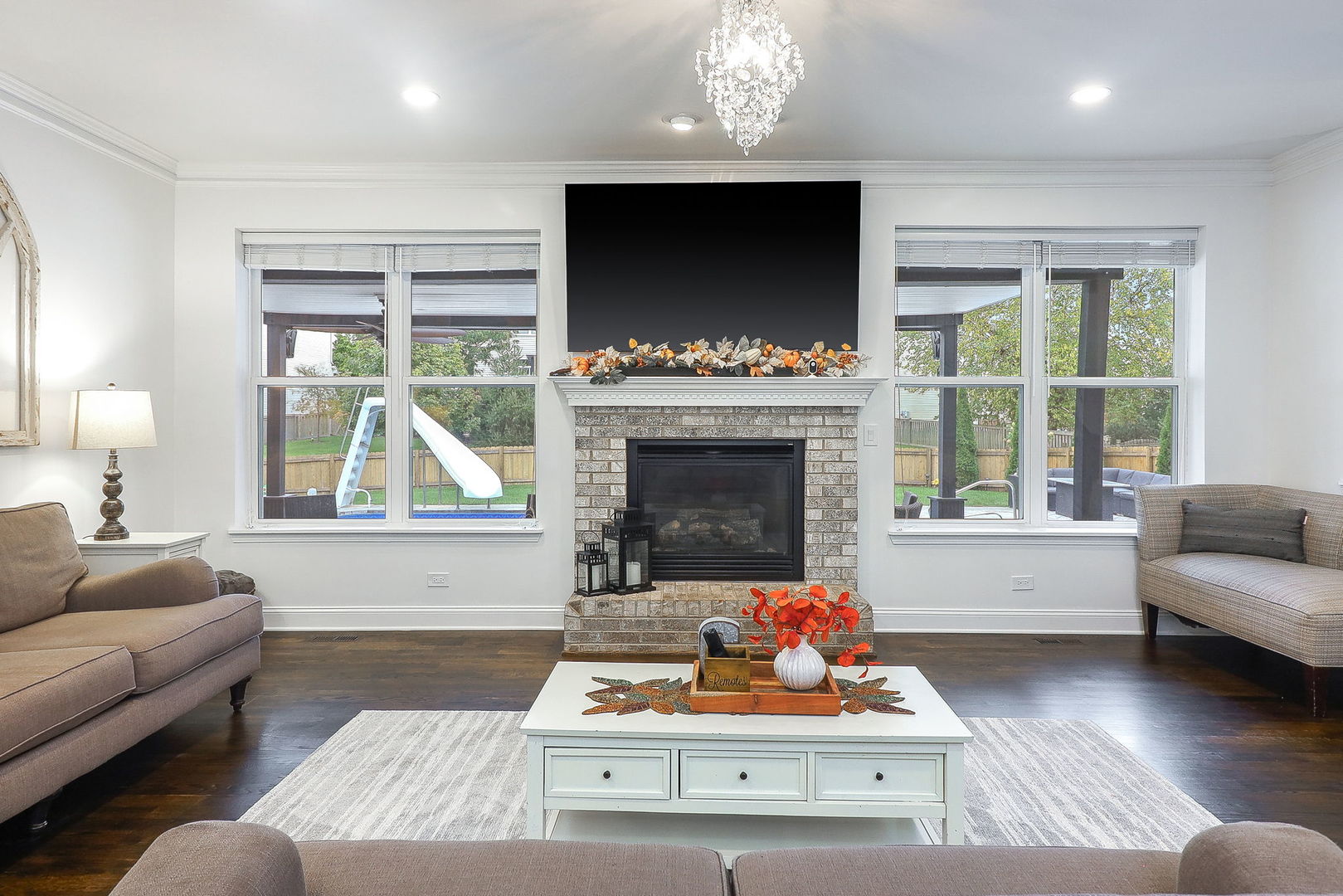335 Forest Trail South Elgin, IL 60177 - Photo 16 of 47 a living room with furniture a flat screen tv and a fireplace