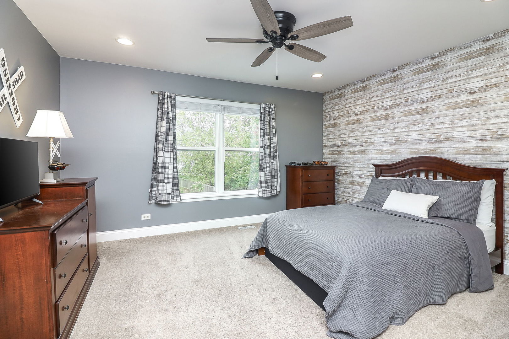 335 Forest Trail South Elgin, IL 60177 - Photo 27 of 47 a spacious bedroom with a bed and a flat screen tv