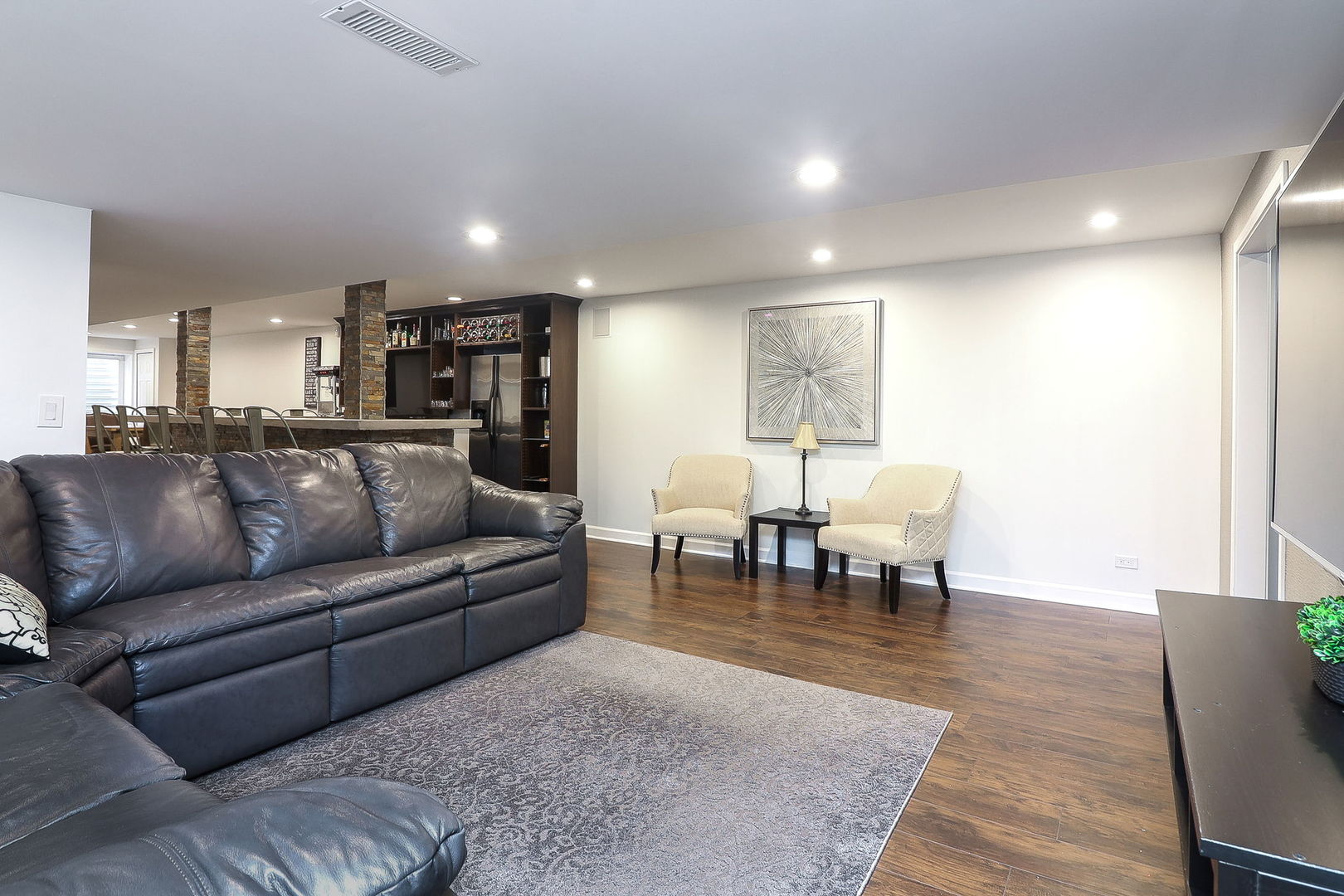 335 Forest Trail South Elgin, IL 60177 - Photo 34 of 47 a living room with furniture a dining table and kitchen view