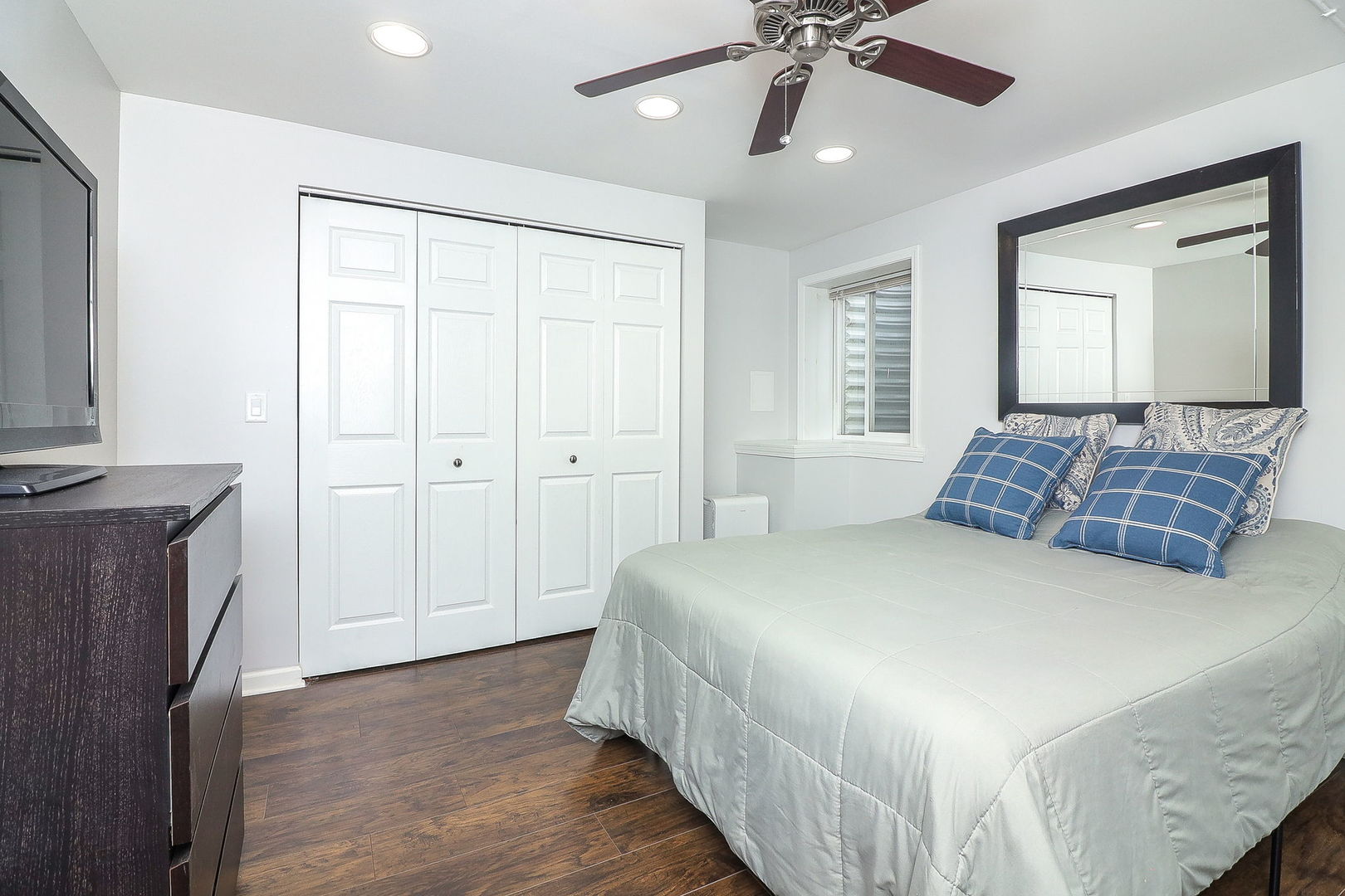 335 Forest Trail South Elgin, IL 60177 - Photo 35 of 47 a bedroom with a large bed and a chandelier