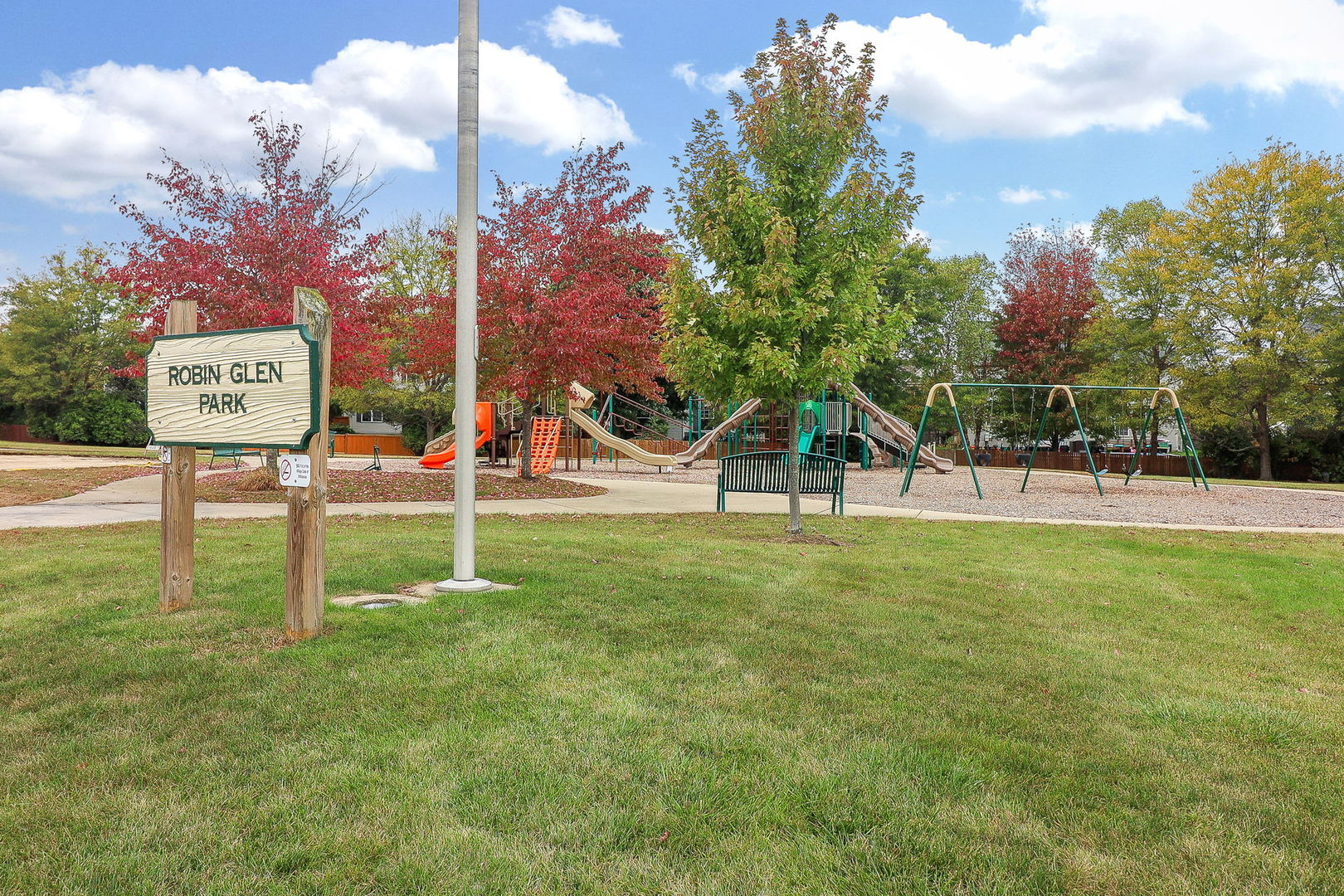 335 Forest Trail South Elgin, IL 60177 - Photo 46 of 47 a view of a park that has a sign board large trees